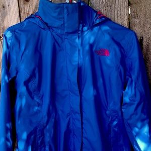 Medium sized pink and blue north face wind breaker